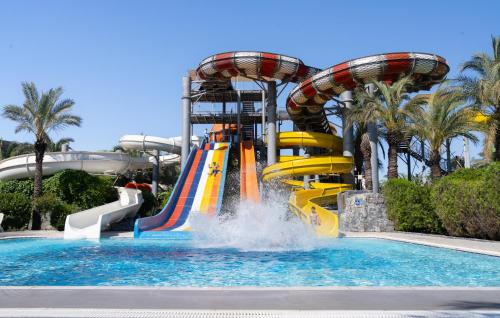 a water park with a roller coaster at Royal Wings Hotel in Lara