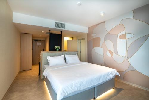 Ένα ή περισσότερα κρεβάτια σε δωμάτιο στο Hotel Zenith