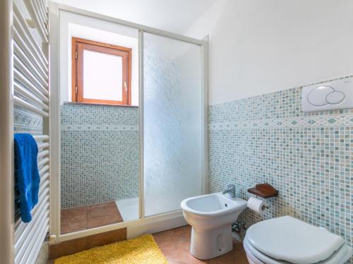 a bathroom with a toilet and a shower at Apartment Fienile by Interhome in Sasso Pisano
