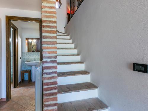 a stairway in a home with a brick wall at Apartment Fienile by Interhome in Sasso Pisano