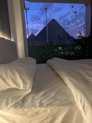 Postel nebo postele na pokoji v ubytování Asia Pyramids lnn