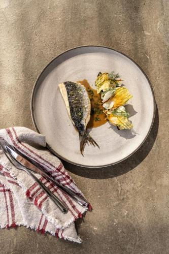a plate of food with two birds on it at Ela Tinos in Arnados