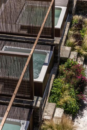 an overhead view of a garden with a swimming pool at Ela Tinos in Arnados