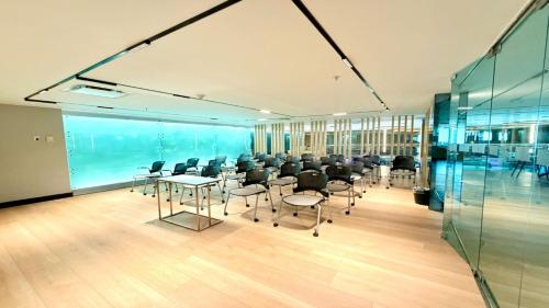 a conference room with chairs and tables in a building at Holiday Inn Express Toluca Galerias Metepec by IHG in Toluca