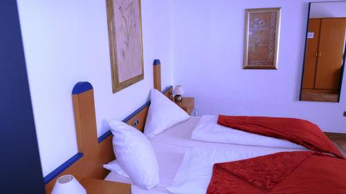 Postel nebo postele na pokoji v ubytování Hotel Krasemann