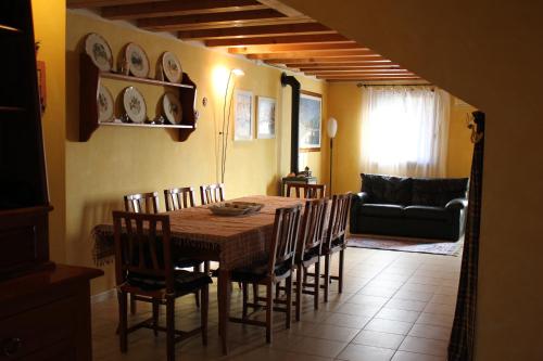 a dining room with a table and chairs at Jasmine Country House in Vicenza