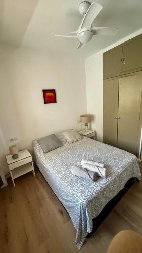 a bedroom with a bed and a ceiling fan at Mariola Vista Mar in Calpe