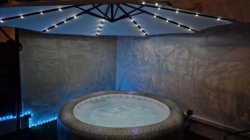 a bath tub in a room with lights at LE MUGEL cocooning SPA et proche calanques de Cassis in Carnoux