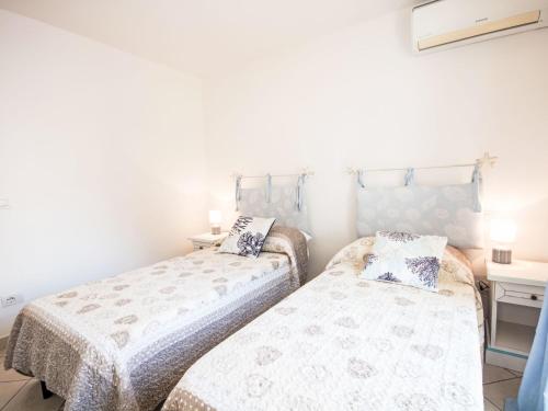Apartment Pitrizza by Interhomeにあるベッド