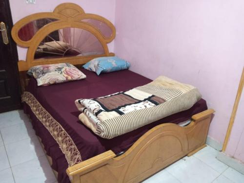A bed or beds in a room at Pyramids Hotel