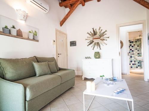 a living room with a couch and a table at Apartment Palau by Interhome in Arzachena