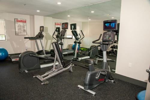 a gym with several exercise bikes and a television at Holiday Inn Express Tucson-Airport by IHG in Tucson