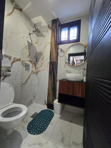 Ein Badezimmer in der Unterkunft Suna'a home Logpom
