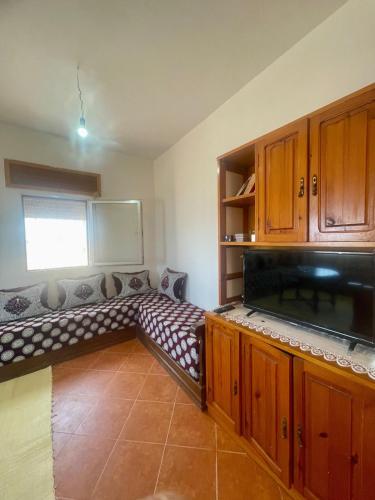 a room with a bench in the middle of a kitchen at Sea View & Comfort in Oued Laou in Oued Laou