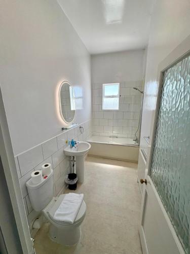 a bathroom with a toilet and a sink at Savoy Hotel in Weston-super-Mare