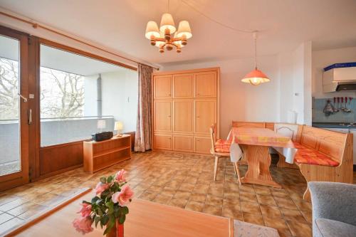 a living room with a table and a couch at FeWo Zeidler Nr42 Sol Mare in Kellenhusen