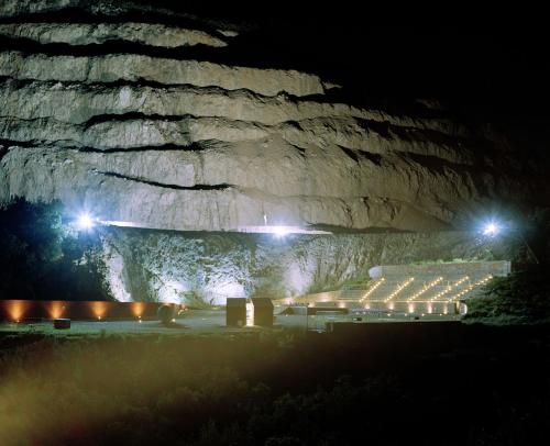 a group of lights in front of a mountain at night at Homeliday RELAX in Caldana