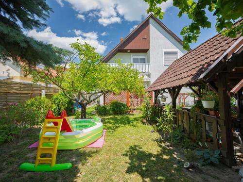 a backyard with a toy pool and a slide at Apartment Noisette by Interhome in Balatonkeresztúr