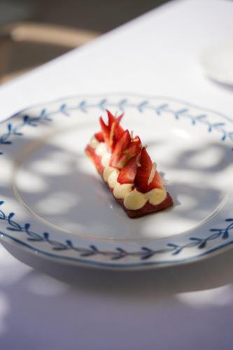 a piece of food on a plate on a table at Relais de Chambord, a Small Luxury Hotels of the World in Chambord