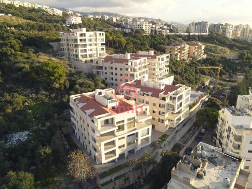 an aerial view of a city with tall buildings at Tabarja Hills apartment in ‘Ayn aş Şughayrah