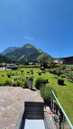 a view of a park with a mountain in the background at Landhaus Thaler in Mittelberg