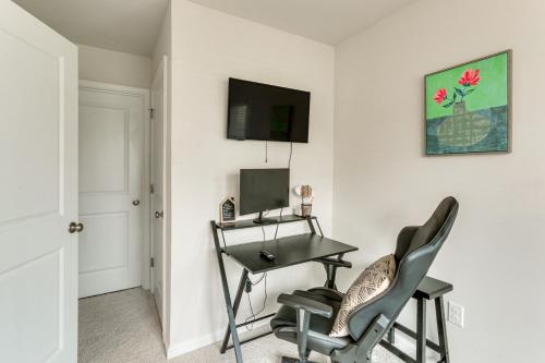 a room with a desk with a computer and two chairs at Frederick Townhome with Balcony, Close to Parks! in Frederick