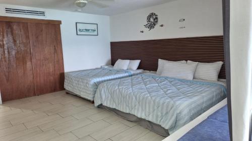 Postel nebo postele na pokoji v ubytování Puerto Vallarta Condo Frente al mar