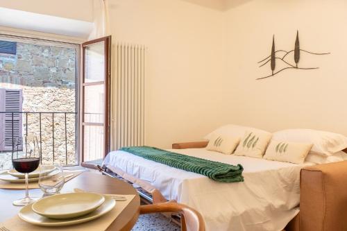 Postel nebo postele na pokoji v ubytování Dolce Pienza I Modern Home in the Historic Center