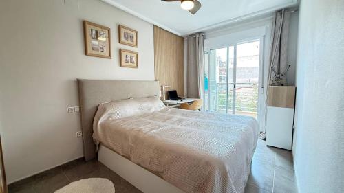 Ένα ή περισσότερα κρεβάτια σε δωμάτιο στο Comfy Apartment Del Cura