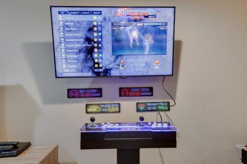 a video game display on a wall with a screen at Mountainview Vista 1 Mile To Water Park & Ski in Tannersville