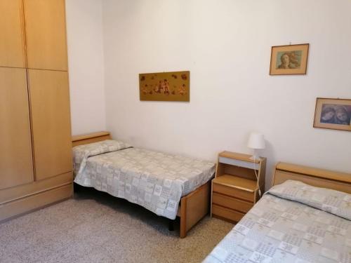 Giường trong phòng chung tại Casa Il Tulipano