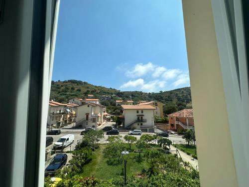 a view from a window of a town with cars at Palazzo Lucia in Ascea