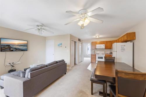 a living room and kitchen with a couch and a table at 3305 Park Blvd, Unit 3 in Wildwood