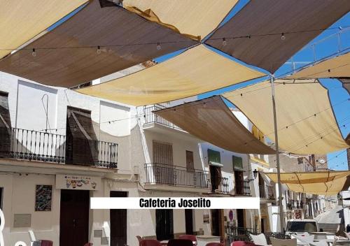 a group of umbrellas hanging over a building at Ruralux Aroche in Aroche