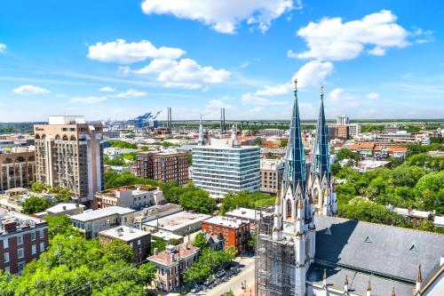 an aerial view of a city with a church at Liberty Mid-Century in Savannah