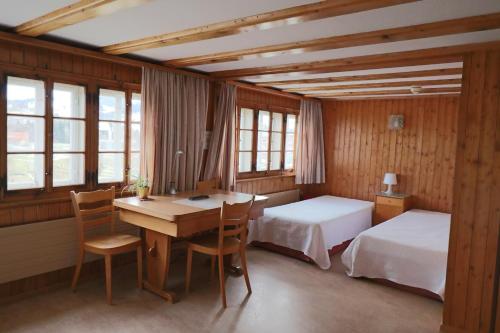 Postel nebo postele na pokoji v ubytování Hotel am Schönenbühl