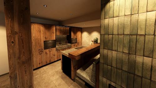 a kitchen with wooden cabinets and a sink at Almhütte Auszeit - Neueröffnung Dezember 2025 in Saalbach Hinterglemm