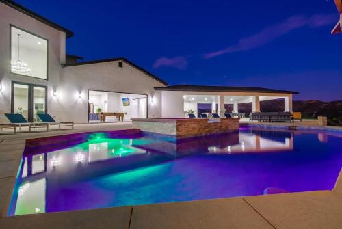 a swimming pool in front of a house at night at Serene Resort-Style Escape - Perfect for Families in El Cajon