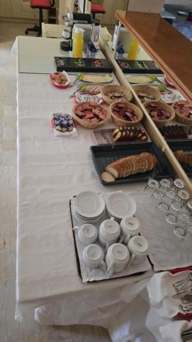 a table with many different types of food on it at Sotiria in Paramonas