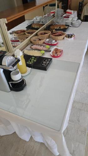 a white table with many different items on it at Sotiria in Paramonas