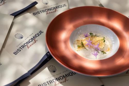 a bowl of food on top of a table at Hotel Royalmar - Nouveau propriétaire in Cagnes-sur-Mer