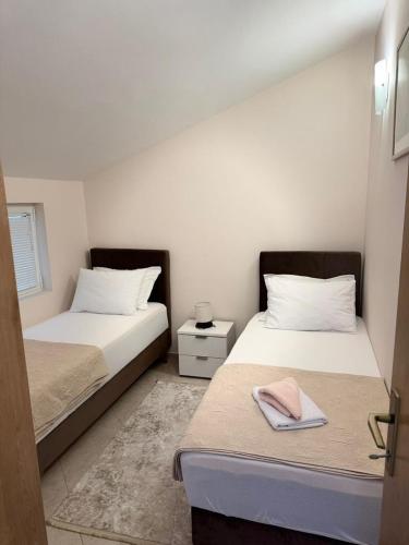 Postel nebo postele na pokoji v ubytování Goga Apartment