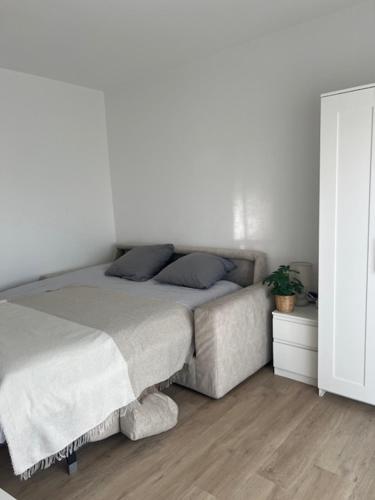 Postel nebo postele na pokoji v ubytování Magnifique F1 à Lingolsheim
