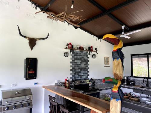 a kitchen with a wooden counter in a room at La Montana Refuge, Costa Rica, Chic Retreat and Pool in San Vito