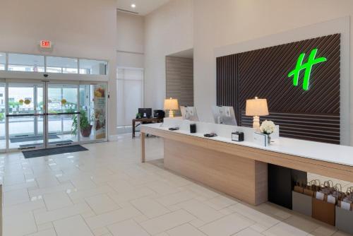 a lobby of a hotel with a reception desk at Holiday Inn Rock Hill by IHG in Rock Hill