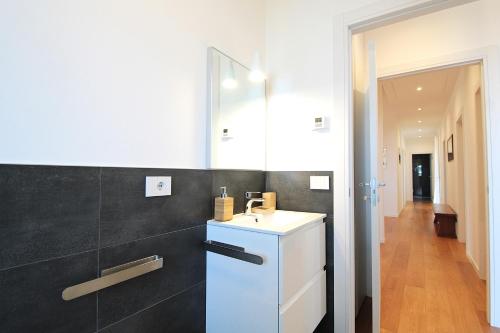a bathroom with a white sink and a mirror at Casa Delle Eriche, Colli Euganei, Pool, Wifi in Teolo