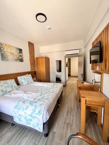 Ένα ή περισσότερα κρεβάτια σε δωμάτιο στο Hotel Panaya