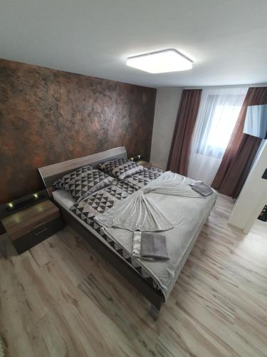 a bedroom with a bed with a painting of a ship at Ferienwohnung Agava in Michelstadt