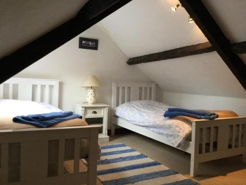 Ένα ή περισσότερα κρεβάτια σε δωμάτιο στο The Cottage, High Street Staithes