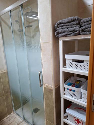 a shower with a glass door in a bathroom at Casa Beby in Candelaria